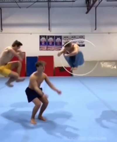 Three men,one hula hoop.