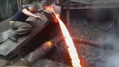 Guy touches molten metal