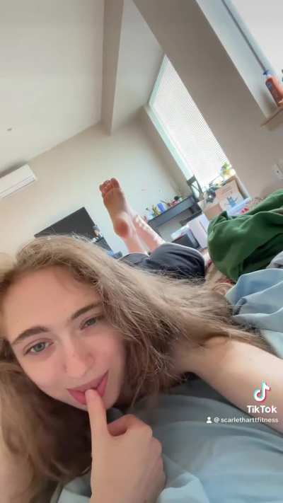 Petite college babe sucks on her thumb seductively while she shows u her feet and booty