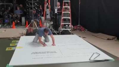 Matt Damon signing his divorce papers in the movie "Downsizing"