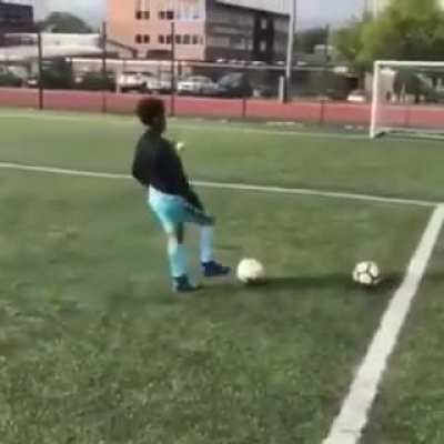 Dad promises his son a new Playstation if he can hit the crossbar three times in a row