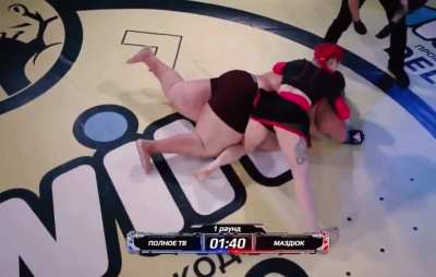 Fat untrained man attempts to fight smaller female professional fighter in MMA