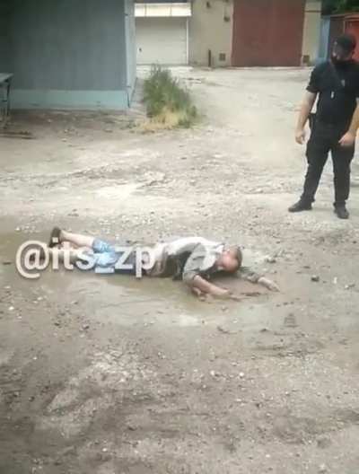 A man is being chased and tries to swim away