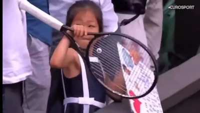 Djokovic giving his racket to a young fan in the crowd. That's sweet :)