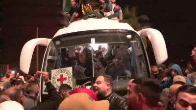Crowds cheer in the west bank as israel releases Palestinians taken hostage including 22 children