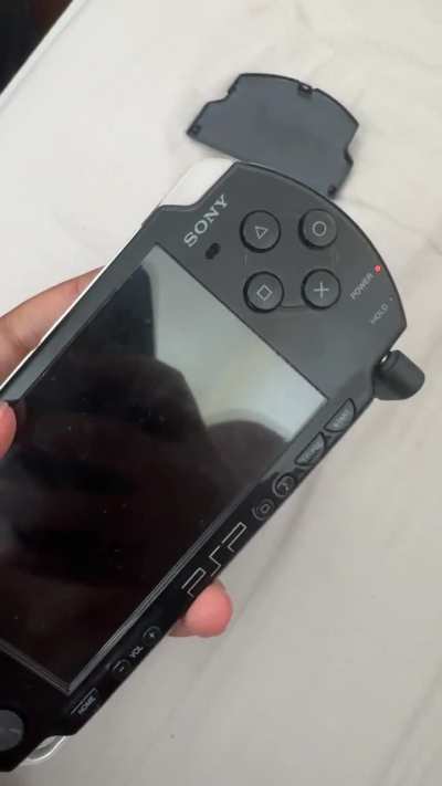 PSP-2003 only seems to charge or turn on when I hold it down near the top