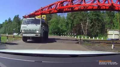 WCGW driving through a railroad crossing while the train is not cleared