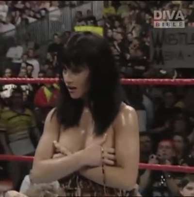 The Kat Flashing Her Breasts after Terri Runnels ripped her top off after the Kat defeated her in an arm-wrestling match, "WWF Insurrextion 2000", Earl's Court, London, England, May 6, 2000