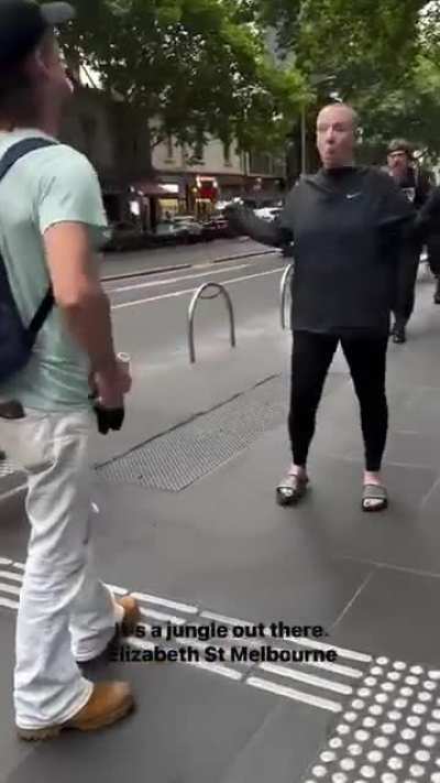 Two classy scholars have a Jim Beam fueled debate in Melbourne CBD.
