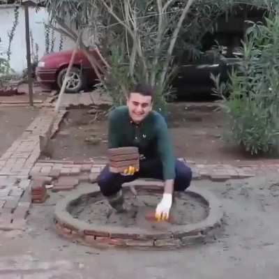 Roger Waters building The Wall around him circa 1977 colorized