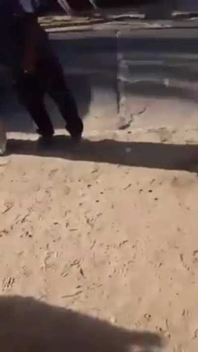 People wrapped up a car thief who had previously hurt an elderly man against an utility post.