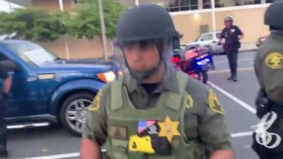 OC Sheriff deputy forgoing his name badge to wear a patch promoting the far right, racist Three-Percenter militia group at tonight&rsquo;s protest in Costa Mesa.