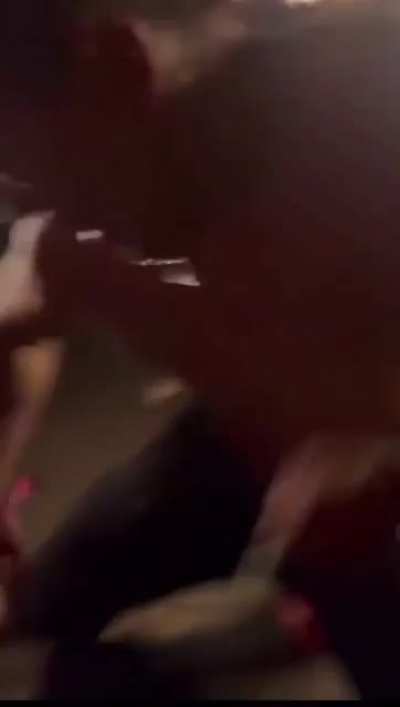 This guy throws a cup of urine on the crowd.