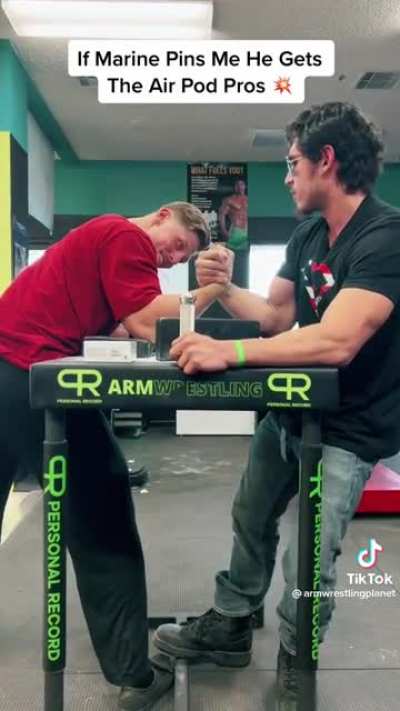 2 men aggressively holding hands with calming music in the background