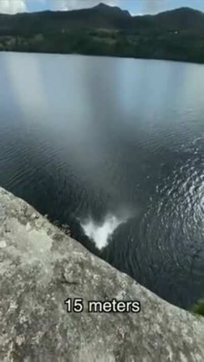 Girl jumps/flops from progressively higher platforms into bodies of water