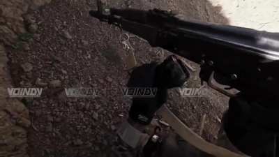 Russian soldiers take Ukrainian position