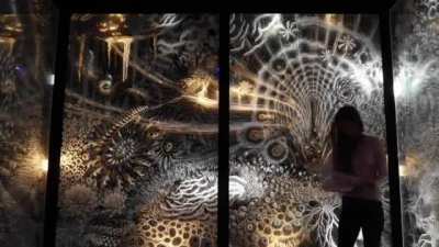 Claudia Bueno layers 60 painted glass panels to achieve this psychedelic art style with light