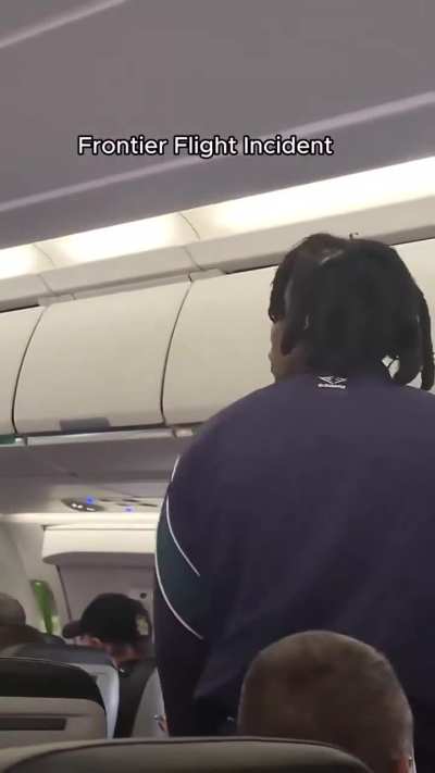 Belligerent guy on an airplane gets booted off