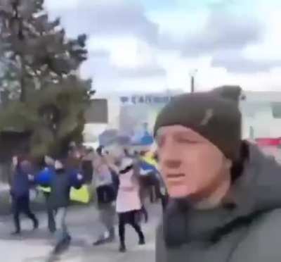 Melitopol, Ukraine. Citizens are walking towards shooting russian soldiers, telling them to get the f*** out, no fear.