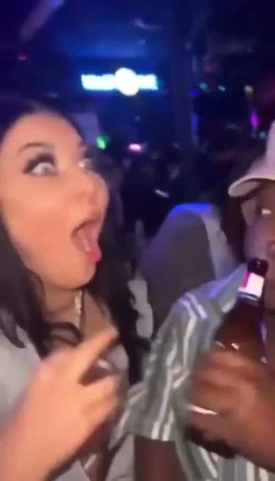 To spit her drink on a stranger