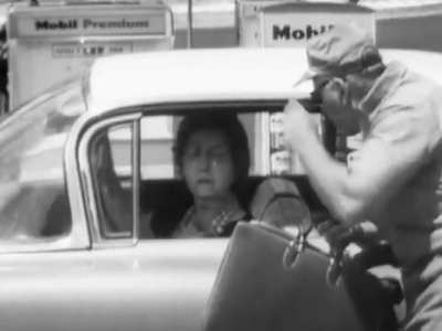 TV Tuesday - Buster Keaton does a prank where a windshield spot is impossible to remove in a sequence on "Candid Camera," with host Alan Funt.