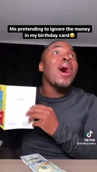 Pretending to ignore the money in a birthday card