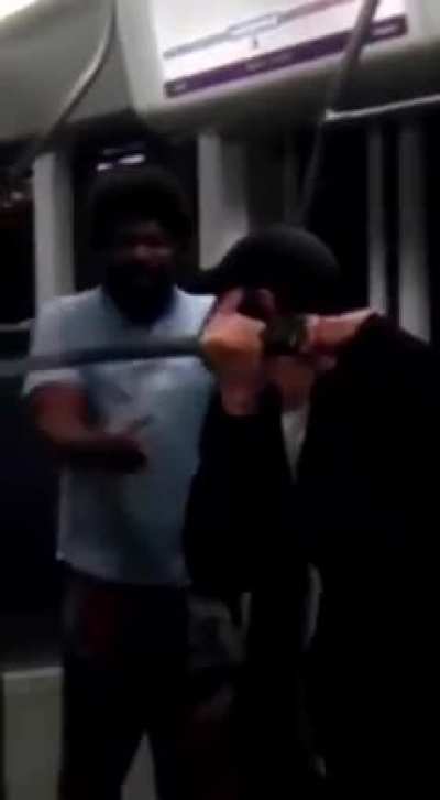 man pulls out katana while another man is being jumped