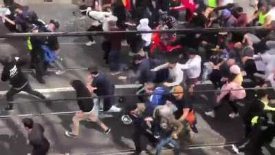 Lockdown protesters in Melbourne, Australia break through a police line and chaos ensues