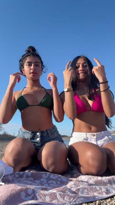 Besties kneeling at the beach