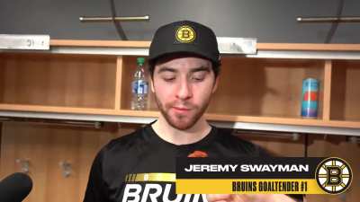 Linus Ullmark hand-feeds Jeremy Swayman a buffalo chicken wing during his post-game interview in Buffalo