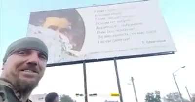 Ua pov While ripping off Russian billboards in retaken cities, Ukrainian soldiers found a quote by Taras Shevchenko that says "Fight on and you will prevail"