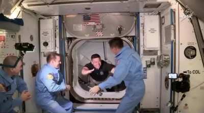 Astronauts Bob Behnken and Doug Hurley arrive on the International Space Station, marking the first time astronauts have entered from a commercial spacecraft