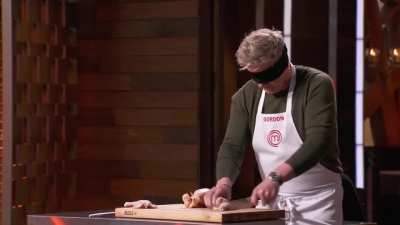 Gordon Ramsay cuts a chicken blindfolded