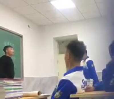 Han Chinese teacher beating a Uyghur student for speaking his native Uyghur language.