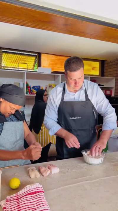 Aunty Radia teaches Mayor Geordin Hill-Lewis how to make delicious pickled fish