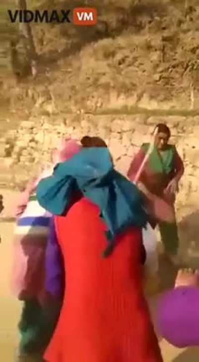 Women in Indian Village group up to beat a wife beater
