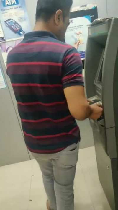 A guy in India flashed his member in an ATM , only to shy away when he gets recorded and later arrested.