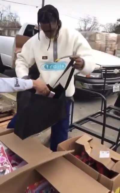 Travis Scott giving away toys to the kids in Houston today