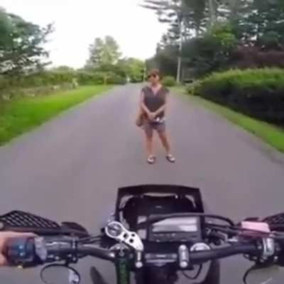 Lady blocks dirt biker because he's too loud