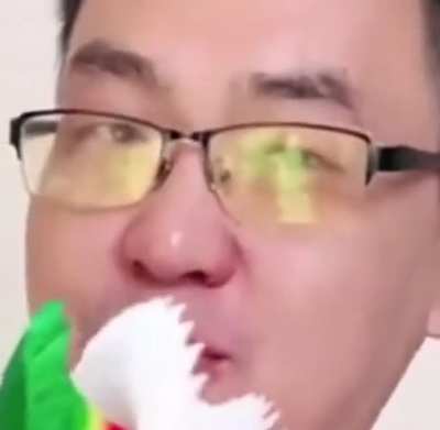 [Unknown&amp;gt;English] curious about if the man on the right is doing like a teaching video or something. Could someone please tell me what he is singing/saying and why he&rsquo;s using the crepe paper on a stick? TIA!
