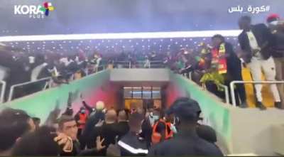 Salah escorted to the dressing room after Senegal fans invaded the pitch