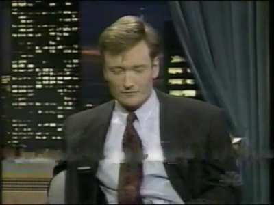 Conan O'Brien, in 1995, interviews actress Famke Janssen... who offers to show him the crushing signature move of "Xenia Onatopp"