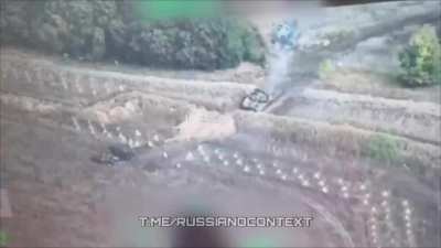 A Ukrainian engineering vehicle clears a passage of 
