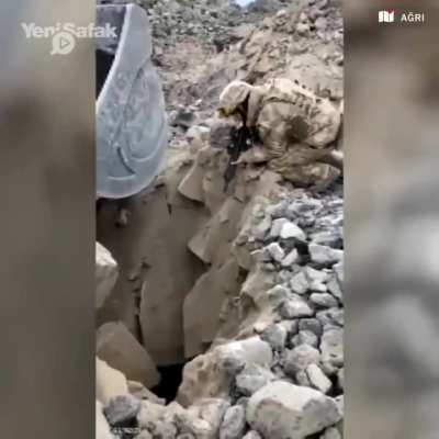 A Turkish Armed Forces member of Kurdish origin gently warns the PKK members in the cave.