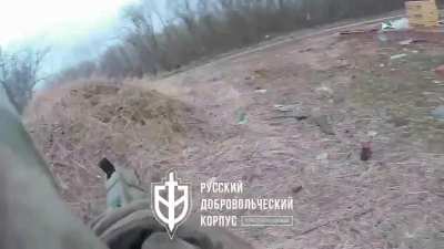 A fighter from the Russian Volunteer Corps ambushes a Russian Tank (00:14). Kozinka, Belgorod Oblast.