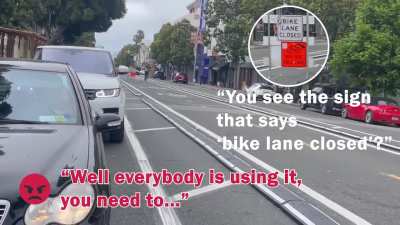 Lady flips out at guy on bike following the rules