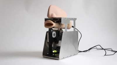 This robotic mouth chants algorithmically generated prayers