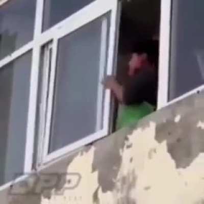 Attempting to remove a wasp's nest