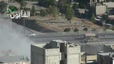 Life &amp;amp; traffic goes on around a Syrian Army T-72 laying rounds into Opposition held neighborhoods in Qaboun, Damascus - 6/23/2013