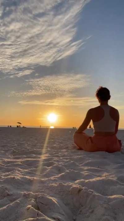 Nicole stretching at the beach